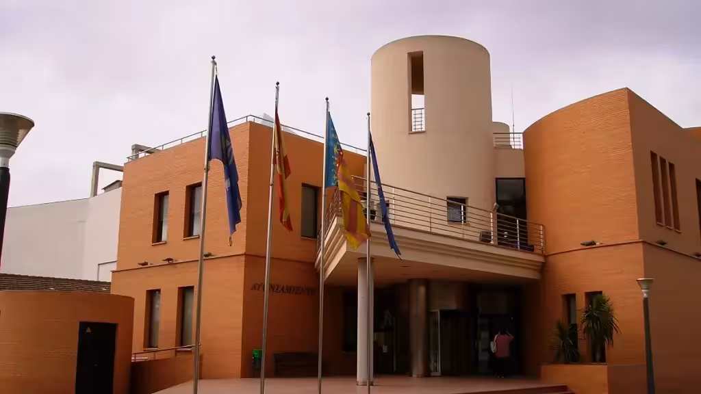 Los Montesinos town hall façade with flags in front of the entrance