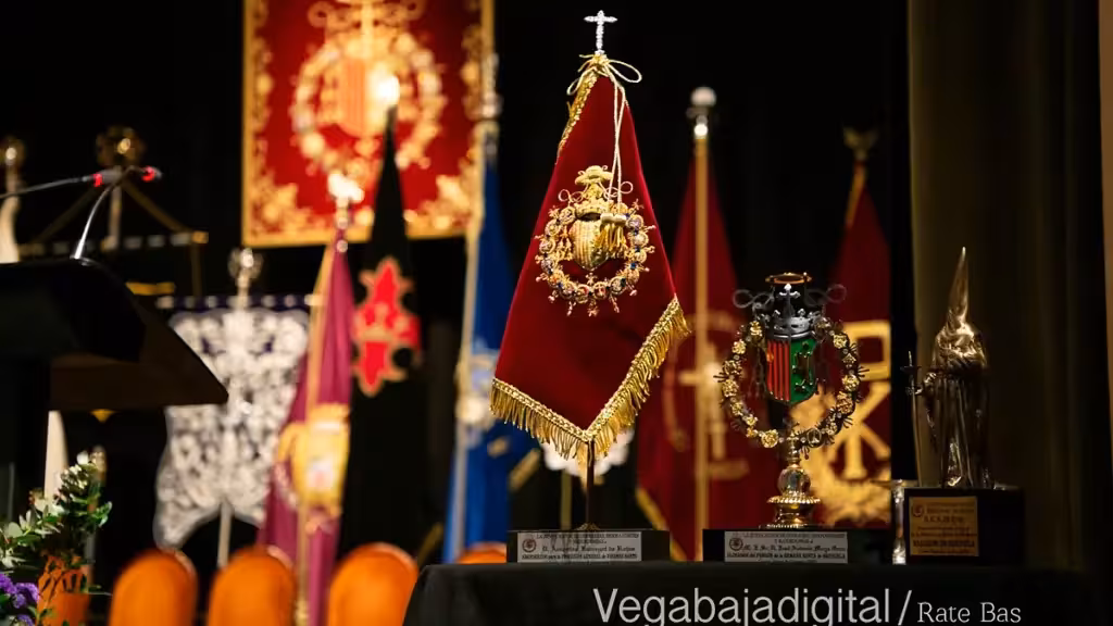 Holy Week banners and awards displayed on a stage